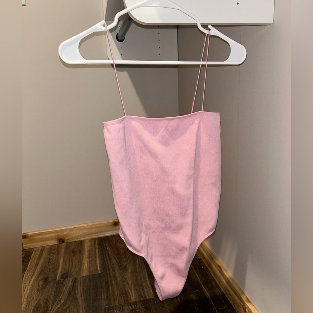 Baby pink body suit